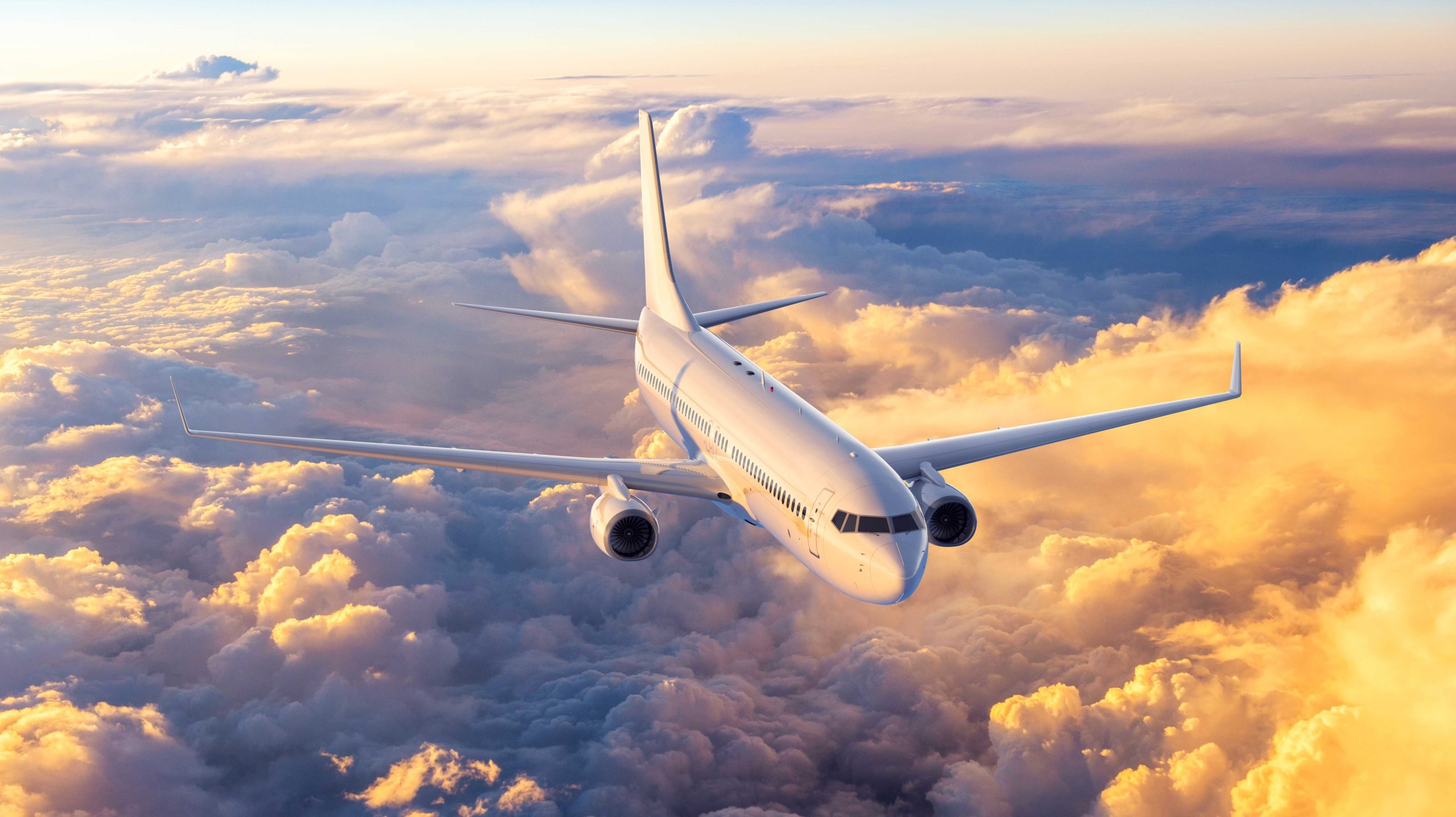 Aero plane flying above clouds